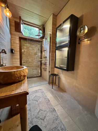 a bathroom with a sink and a large window at Casita Balear Sa Coveta in Algaida