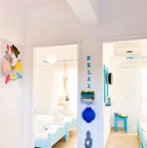 a hospital room with two beds and a doorway at Family Garden in Sidari