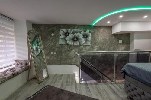 a room with a bed and a glass staircase at Matija Lux2 in Kraljevo