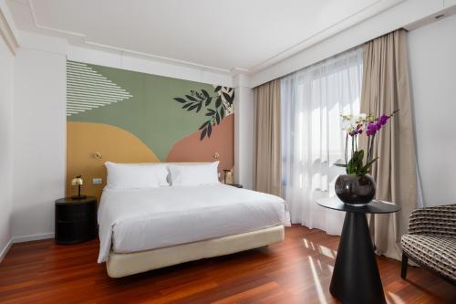 Postel nebo postele na pokoji v ubytování DoubleTree by Hilton Florence Metropole