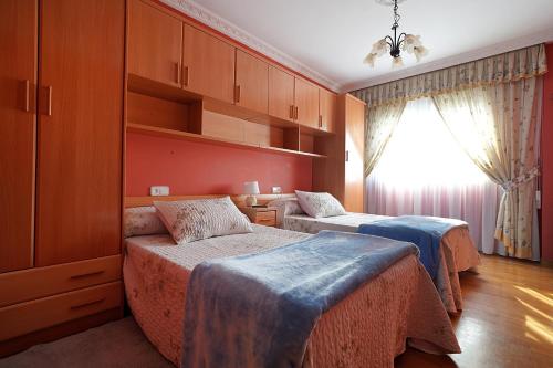 Ένα ή περισσότερα κρεβάτια σε δωμάτιο στο Apartamento As Carolinas