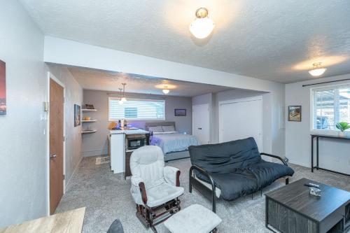 a living room with a couch and a bed at Tranquil Private Studio in Lacey