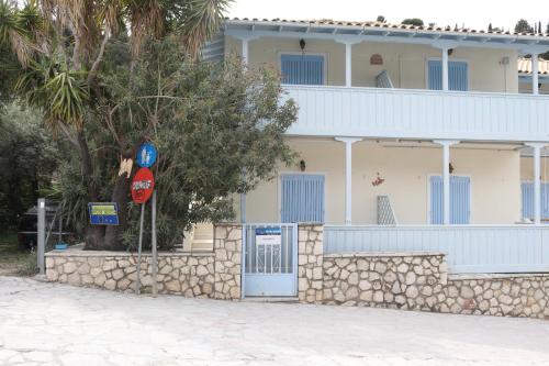 a building with a stop sign in front of it at Villa Milia 2 in Agios Nikitas
