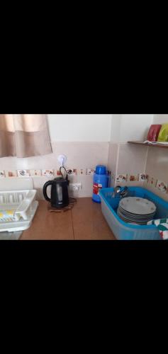 a bathroom with a toilet and a sink in it at Noah'house in Nazca