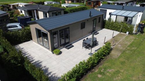 an aerial view of a house with a patio at Chalet "De Vliegden" in Stroe