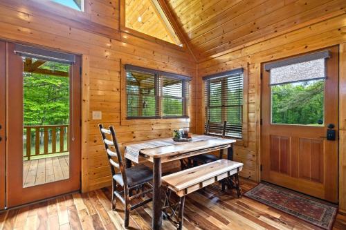 a dining room with a wooden table and chairs at Gentle Ben's Chalet in Murphy