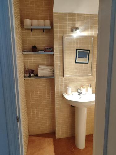 a bathroom with a sink and a mirror at Relax Pinares in Lepe