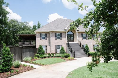 a large brick house with a driveway at Downtown Estate Luxury Property in Hammond