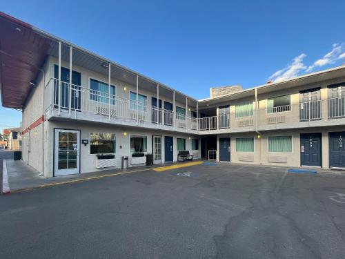an empty parking lot in front of a building at Motel 6 Las Vegas, NV - Strip in Las Vegas