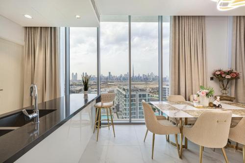 a dining room with a view of the city at Luxury 2 Bedroom plus kids room Burj Khalifa View in Dubai