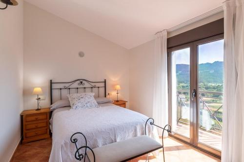 Posteľ alebo postele v izbe v ubytovaní Apartamentos Rurales de Abelleira