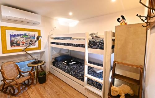 a bunk bed room with two bunk beds at DUPLEX 5 chambres Clim WIFI SAUNA Cannes in Cannes