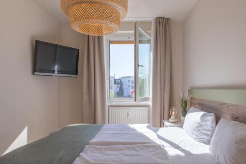 Postel nebo postele na pokoji v ubytování Küstenglück - Ferienwohnung im 1Obergeschoss mit Balkon