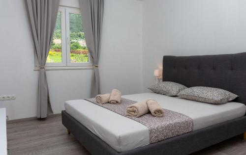 Ένα ή περισσότερα κρεβάτια σε δωμάτιο στο AnTina Apartment