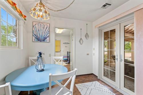 a dining room with a blue table and chairs at Home in San Diego! The Blue Leaf with 3bed 2bath, Golf, Large Yard! in Rancho Bernardo