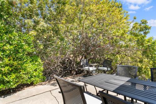a picnic table and chairs on a patio with trees at Home in San Diego! The Blue Leaf with 3bed 2bath, Golf, Large Yard! in Rancho Bernardo