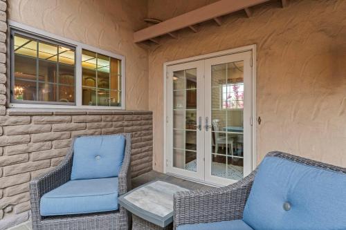 two chairs and a table on the porch of a house at Home in San Diego! The Blue Leaf with 3bed 2bath, Golf, Large Yard! in Rancho Bernardo