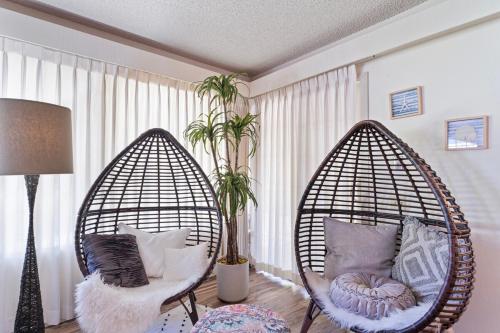 two hanging chairs in a living room with pillows at Home in San Diego! The Blue Leaf with 3bed 2bath, Golf, Large Yard! in Rancho Bernardo