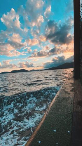a boat in the water under a bridge at Hostel ABC in Angra dos Reis