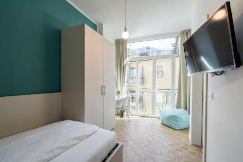 Ένα ή περισσότερα κρεβάτια σε δωμάτιο στο Stay COOPER l Capitol Rooms