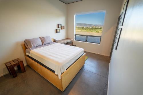Postel nebo postele na pokoji v ubytování LAR Valle de Guadalupe