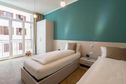 Postel nebo postele na pokoji v ubytování Stay COOPER l Capitol Rooms