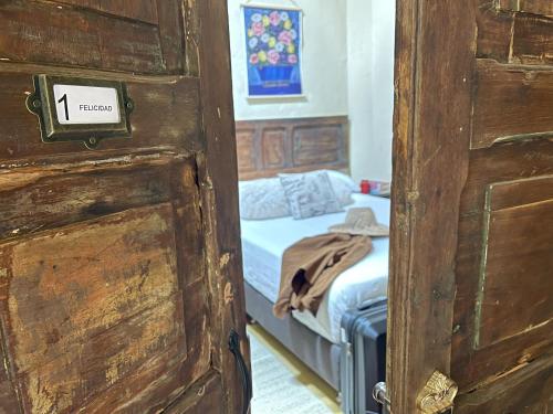 a door leading to a bedroom with a bed at Colivingranada in Envigado