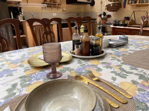 a table with a table cloth with a bowl and utensils at Colivingranada in Envigado