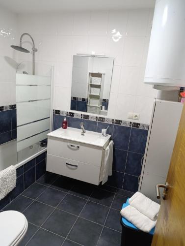 a bathroom with a sink and a toilet at Cruz de Baixar in Fisterra