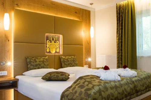 das Balance - Spa & Golf Hotel am Wörtherseeにあるベッド