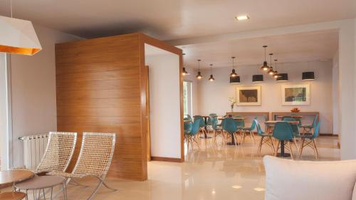 a dining room with chairs and a table in it at Amalinas Hotel in San Lorenzo