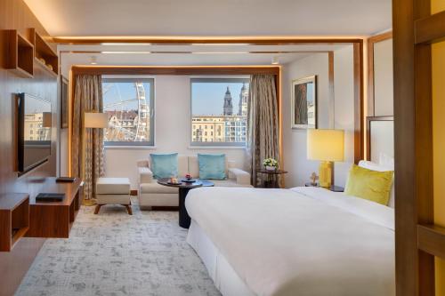 A bed or beds in a room at Kempinski Hotel Corvinus Budapest
