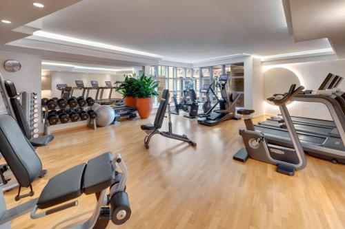 a gym with treadmills ellipticals and exercise bikes at Kempinski Hotel Corvinus Budapest in Budapest