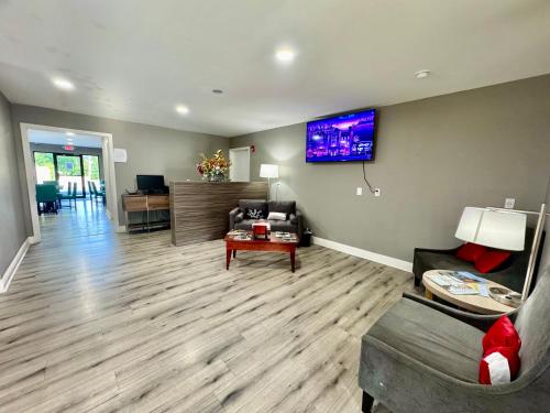 a living room with a couch and a table at Premier Extended Stay in Kennesaw