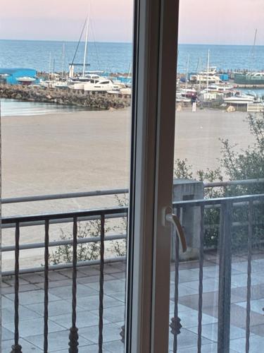 a view of a marina from a balcony at ElStefanino House in Eforie Nord