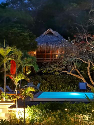 a view of a resort at night at Hotel Playa Scondida Barú in Baru