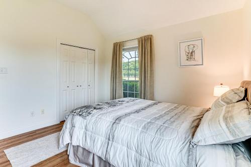 a bedroom with a bed and a window at Spacious Family Retreat in Fort Worth Area! in Aledo