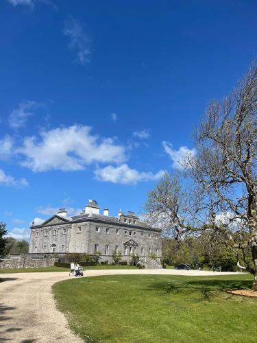 a large castle with a grassy field in front of it at Rolling Hills in Westport