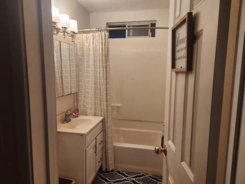 a bathroom with a sink and a shower at Nearby Beach House in El Segundo