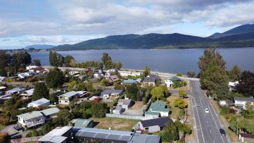 an aerial view of a small town next to a lake at Shakespeare House in Te Anau