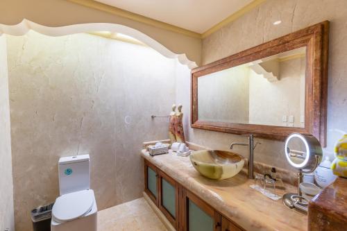 a bathroom with a sink and a mirror at P V near Colomitos Beach Boutique Hotel in Puerto Vallarta