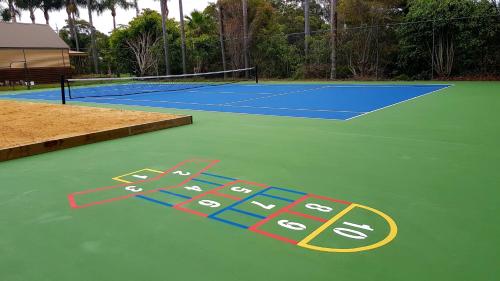 a rendering of a tennis court at Wairo Beach Holiday Park in Lake Tabourie