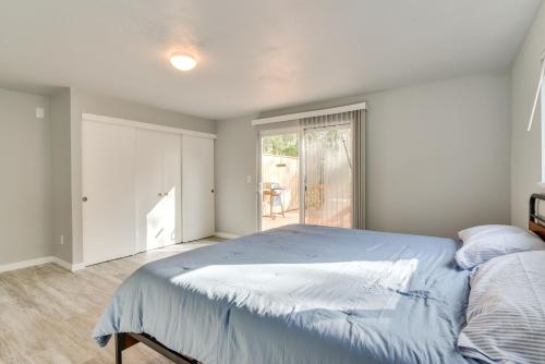 a bedroom with a large bed and a window at Walk to Dtwn Milwaukie Family Gem with Creek Access in Milwaukie