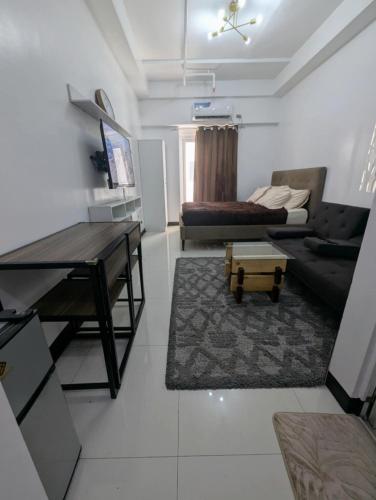 Televisyen dan/atau pusat hiburan di Miya's Crib Staycation A