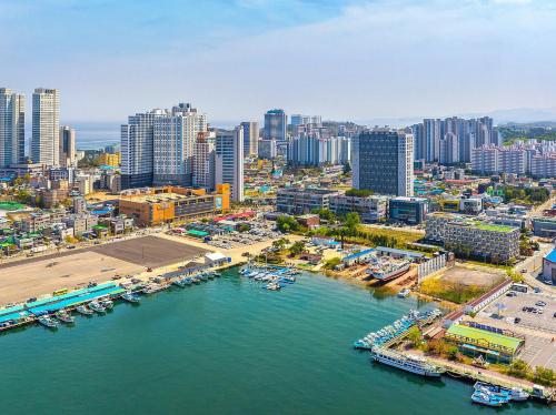 an aerial view of a city with a harbor at Sokcho Mari Vista Hotel in Sokcho