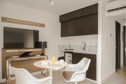 TV a/nebo společenská místnost v ubytování Vivaldi Hotel Loft Punta Carretas