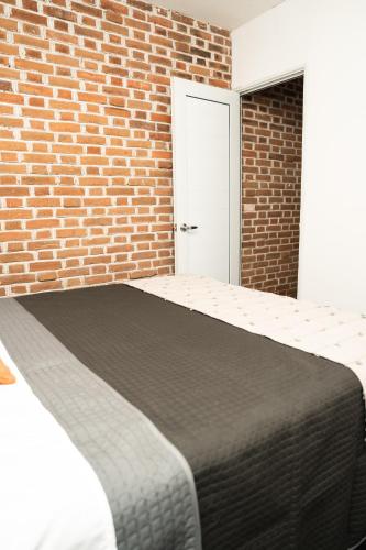 Ένα ή περισσότερα κρεβάτια σε δωμάτιο στο Central Hostel Dolce Vita