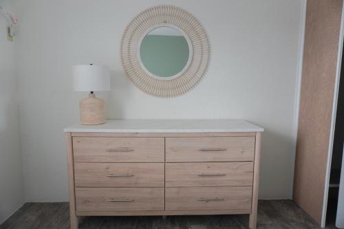 a dresser with a mirror on top of it at Pier Point in Wildwood