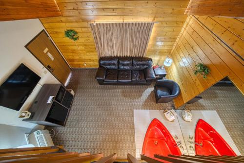 an overhead view of a living room with a leather couch at Super 8 by Wyndham Sturgis in Sturgis