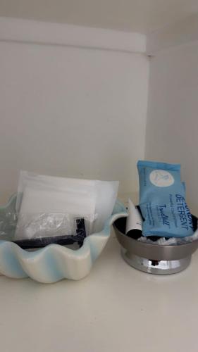 a container of food sitting next to a bowl of food at Oxford Manor Apt - Kingston - Economy stay in Kingston